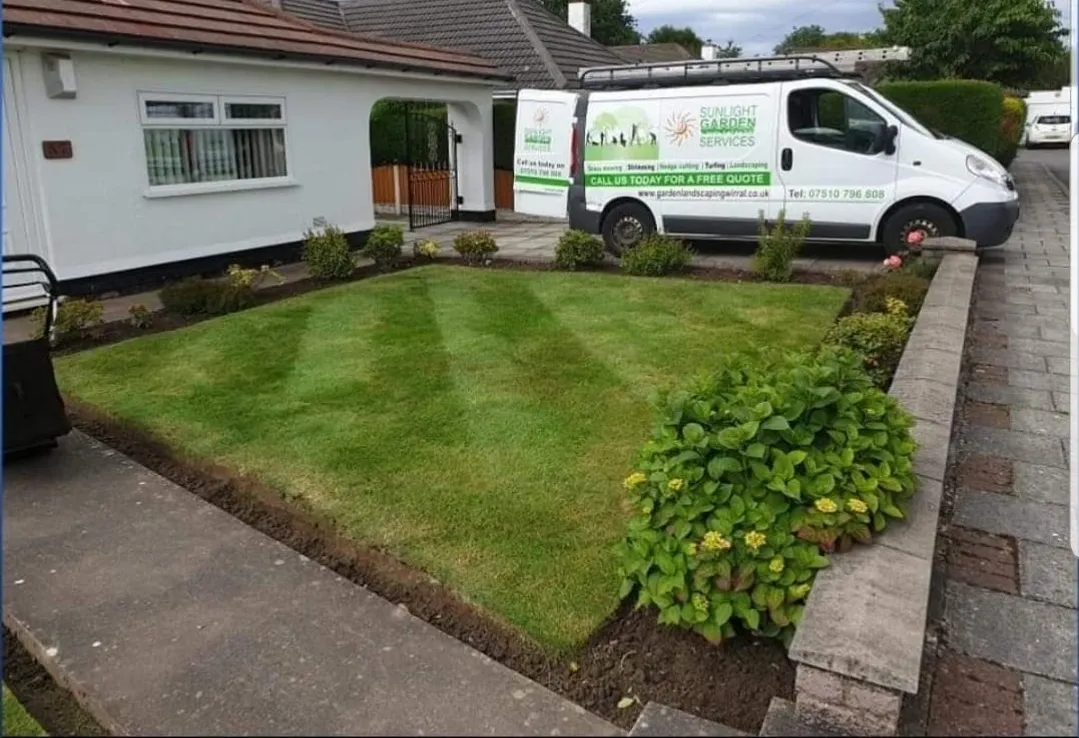 Sunlight Garden Services van with ladder outside a Liverpool property showing the guttering and downpipe